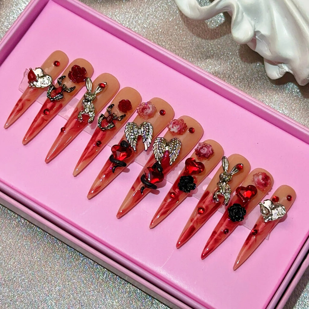 Ongles press-on en acrylique faits main, design de créateur avec strass, forme amande, longueur longue, livrés avec colle, emballage personnalisé.