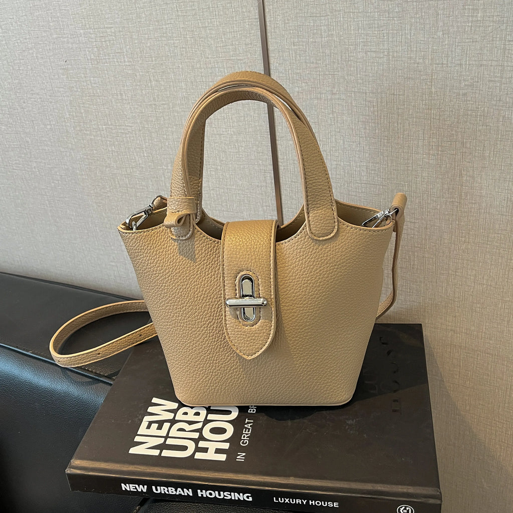 Sac à bandoulière pour femme en PU haut de gamme, nouvelle collection printemps 2026, élégant et facile à assortir. Sac seau raffiné pour les déplacements quotidiens, porté épaule ou croisé, avec fermeture à fermoir