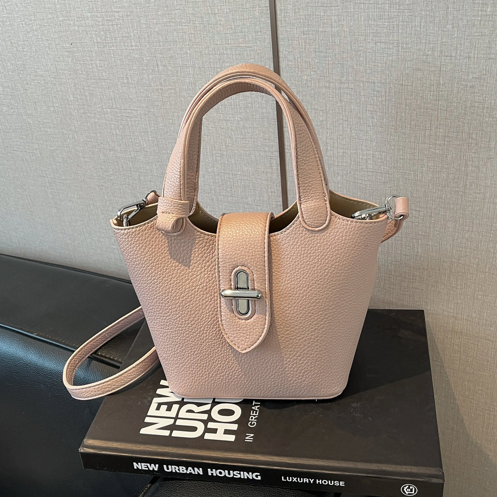 Sac à bandoulière pour femme en PU haut de gamme, nouvelle collection printemps 2026, élégant et facile à assortir. Sac seau raffiné pour les déplacements quotidiens, porté épaule ou croisé, avec fermeture à fermoir