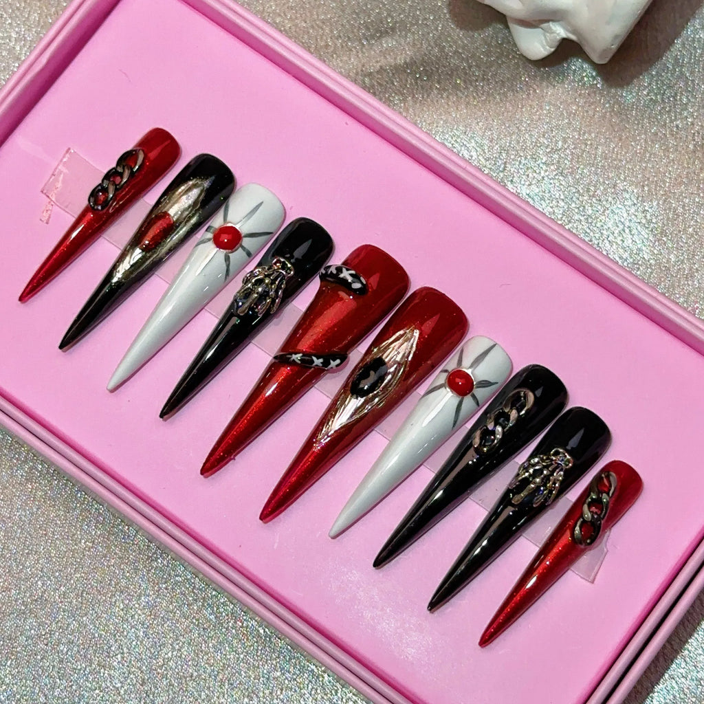 Ongles press-on en acrylique faits main, design de créateur avec strass, forme amande, longueur longue, livrés avec colle, emballage personnalisé.