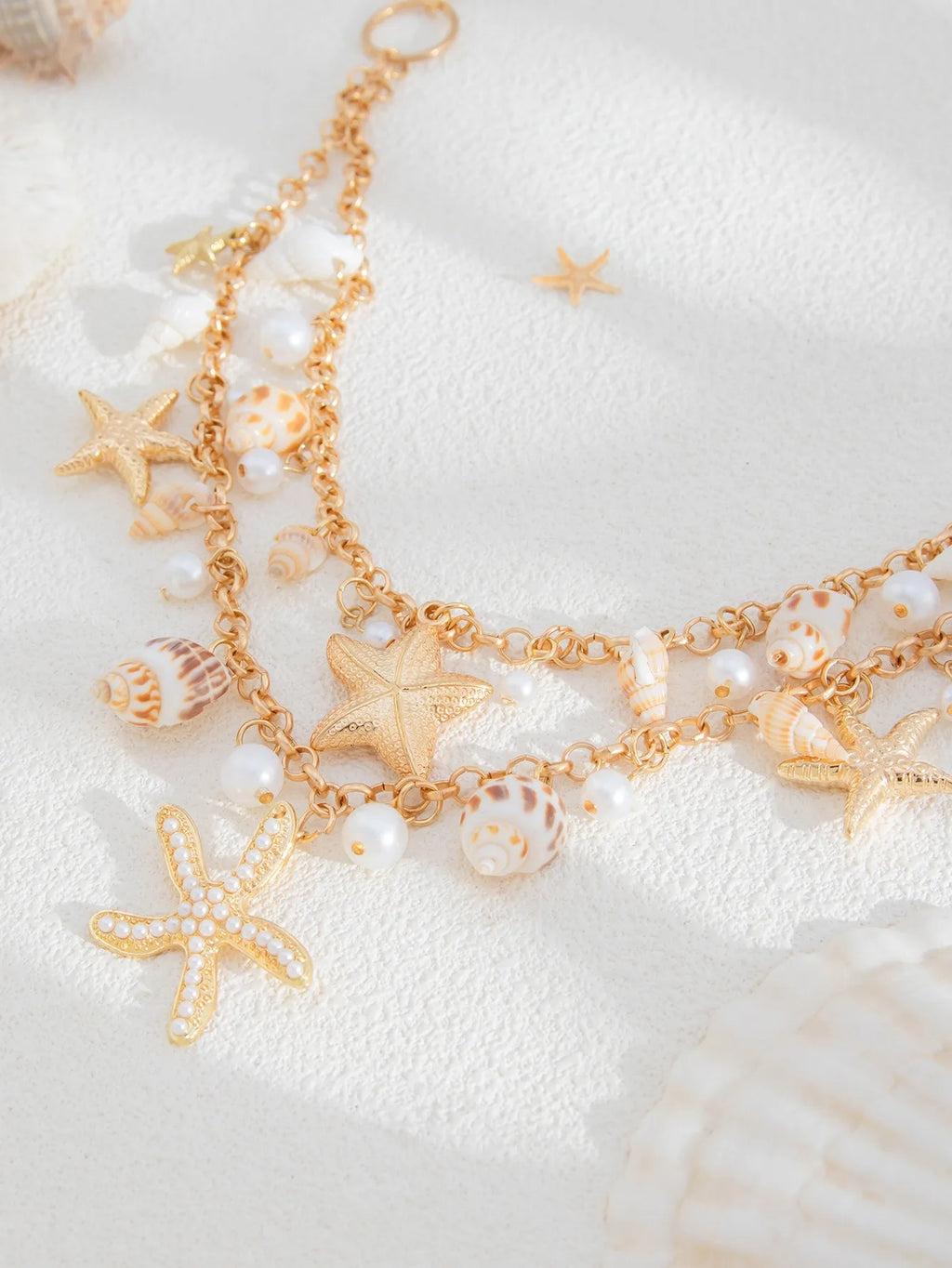 Nouvelle chaîne de taille en coquillage d'étoile de mer de plage bohème européenne et américaine, chaîne de corps en forme de conque de perle d'imitation de mode