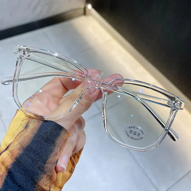 Lunettes vintage transparentes pour ordinateur, pour femmes et hommes, avec monture carrée. Lunettes anti-lumière bleue conçues pour filtrer la lumière bleue émise par les écrans. Monture optique transparente et élégante, adaptée à un usage quotidien.