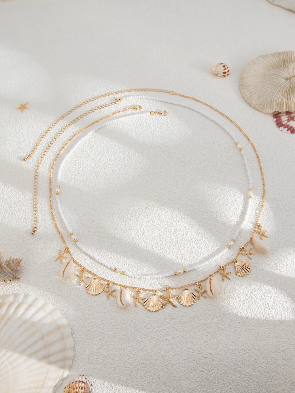 Nouvelle chaîne de taille en coquillage d'étoile de mer de plage bohème européenne et américaine, chaîne de corps en forme de conque de perle d'imitation de mode
