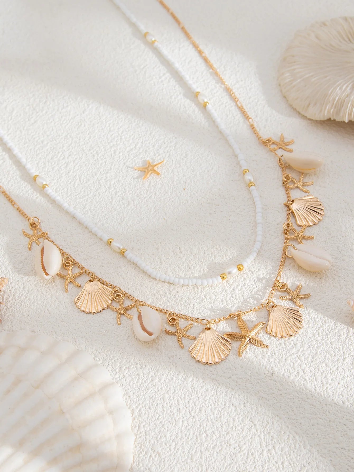 Nouvelle chaîne de taille en coquillage d'étoile de mer de plage bohème européenne et américaine, chaîne de corps en forme de conque de perle d'imitation de mode