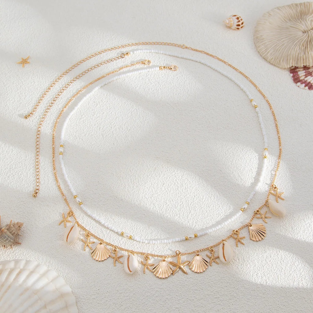 Nouvelle chaîne de taille en coquillage d'étoile de mer de plage bohème européenne et américaine, chaîne de corps en forme de conque de perle d'imitation de mode