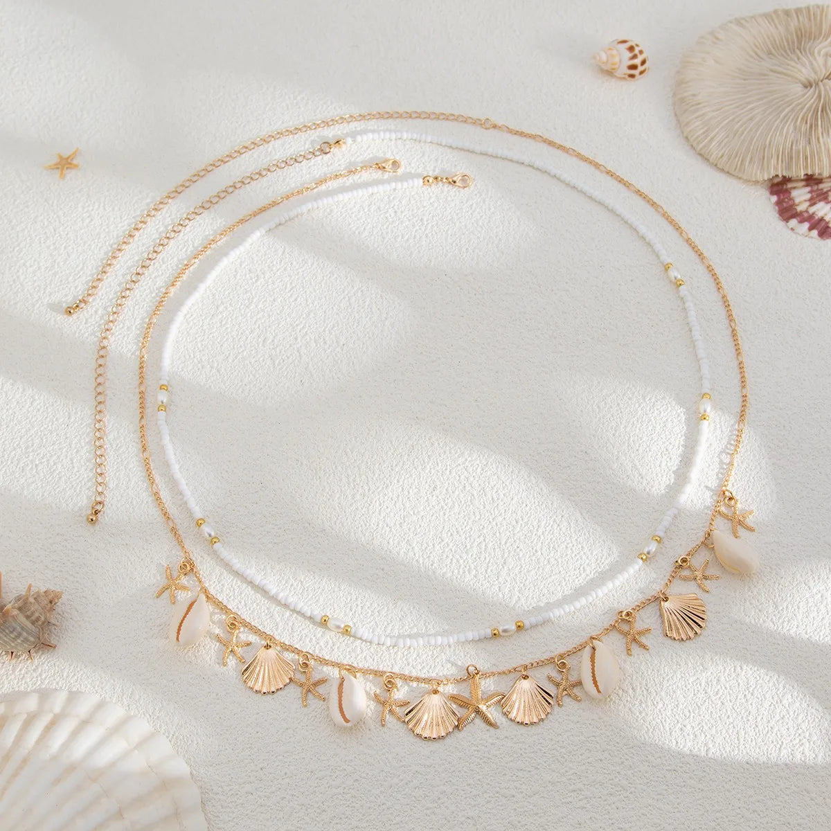 Nouvelle chaîne de taille en coquillage d'étoile de mer de plage bohème européenne et américaine, chaîne de corps en forme de conque de perle d'imitation de mode